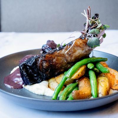 Grilled lamb chops with cauliflower puree, roasted potatoes, and green beans.