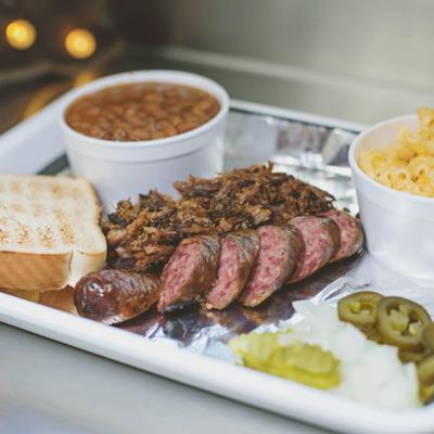 Two meat combo platter, served with two sides, front view, closeup.
