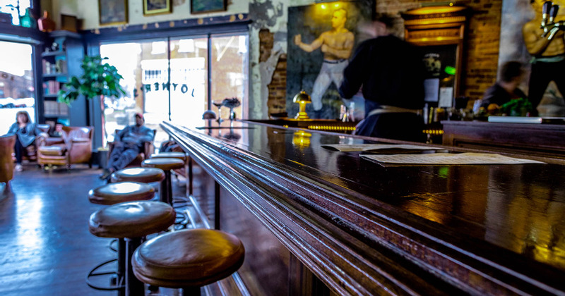 Closeup of the bar counter with lined up stools