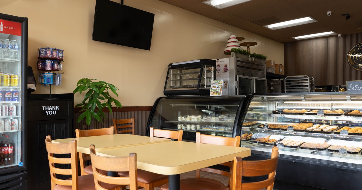Interior, tables and chairs near food display
