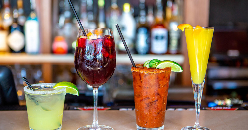 Bar counter, lined up cocktails