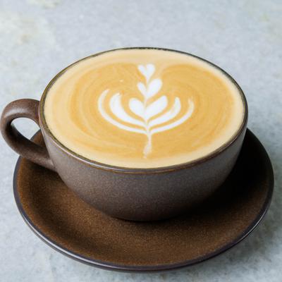 Latte with leaf-shaped latte art.