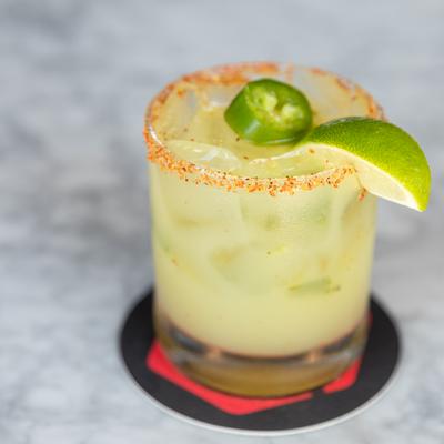 Yellow drink with lime and jalapeno.