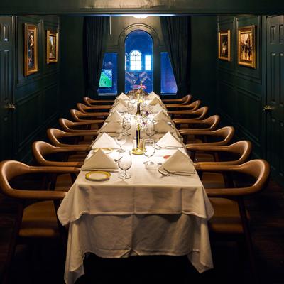 Elegant banquet room with a fully arranged table.