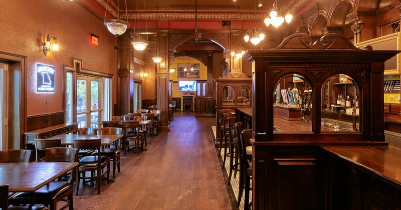 Interior, lined up tables by the windows