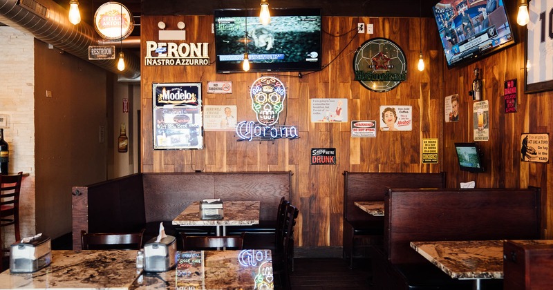 Interior, booths, big TVs on the wall