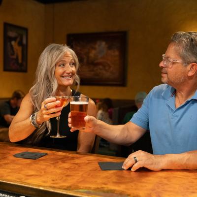 People toasting with drinks.
