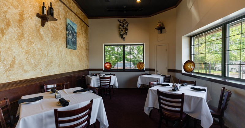 Interior, set dining tables ready to receive guests