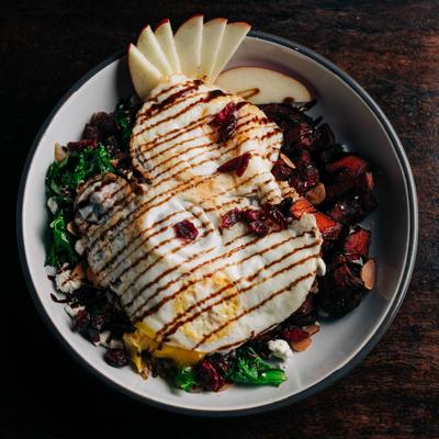 Harvest bowl topped with eggs, apples, and balsamic drizzle  Detailed description:.