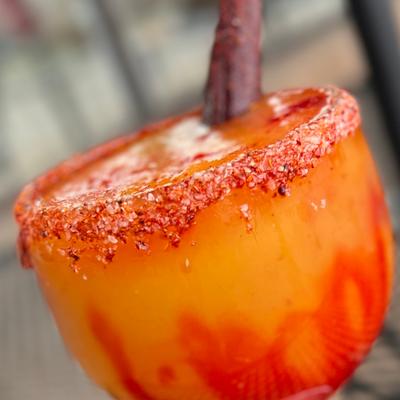 Mangonada Margarita in a cold margartia bowl glass rimmed with tajin and chamoy voted the best margarita.