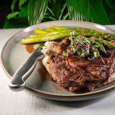 Grilled ribeye steak, with garlic mashed potatoes, and asparagus.