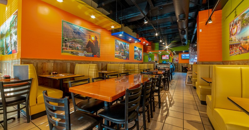 Interior space, dining area with tables, chairs and dining booths