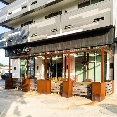 El Naranjo restaurant exterior with outdoor seating.
