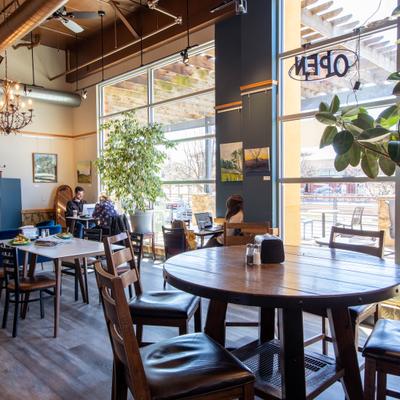 Tables and chairs, a view through the window.
