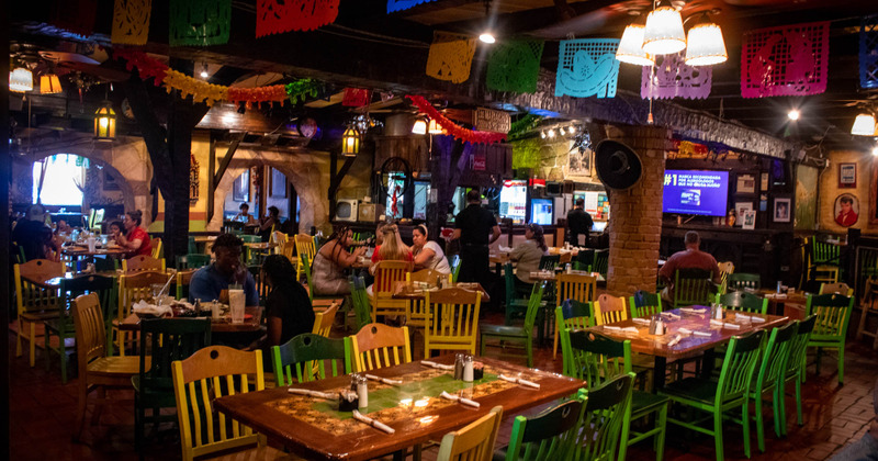 Interior, dimmed light, tables and chairs