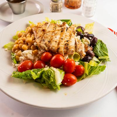 Chicken Mediterranean salad with chickpeas, cherry tomatoes, and feta cheese