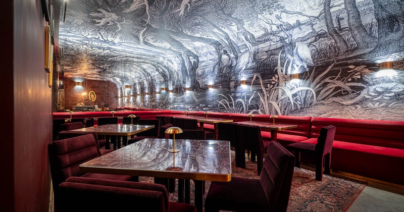 Interior, tables and chairs with banquet seating ready for guests