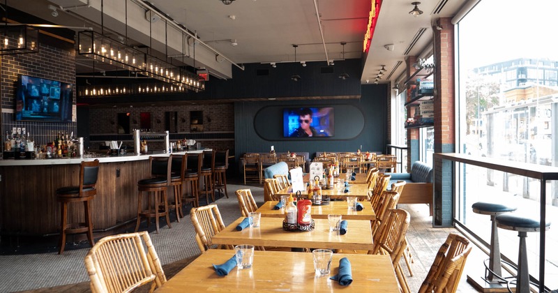 Interior, dining area with a large wall TV set