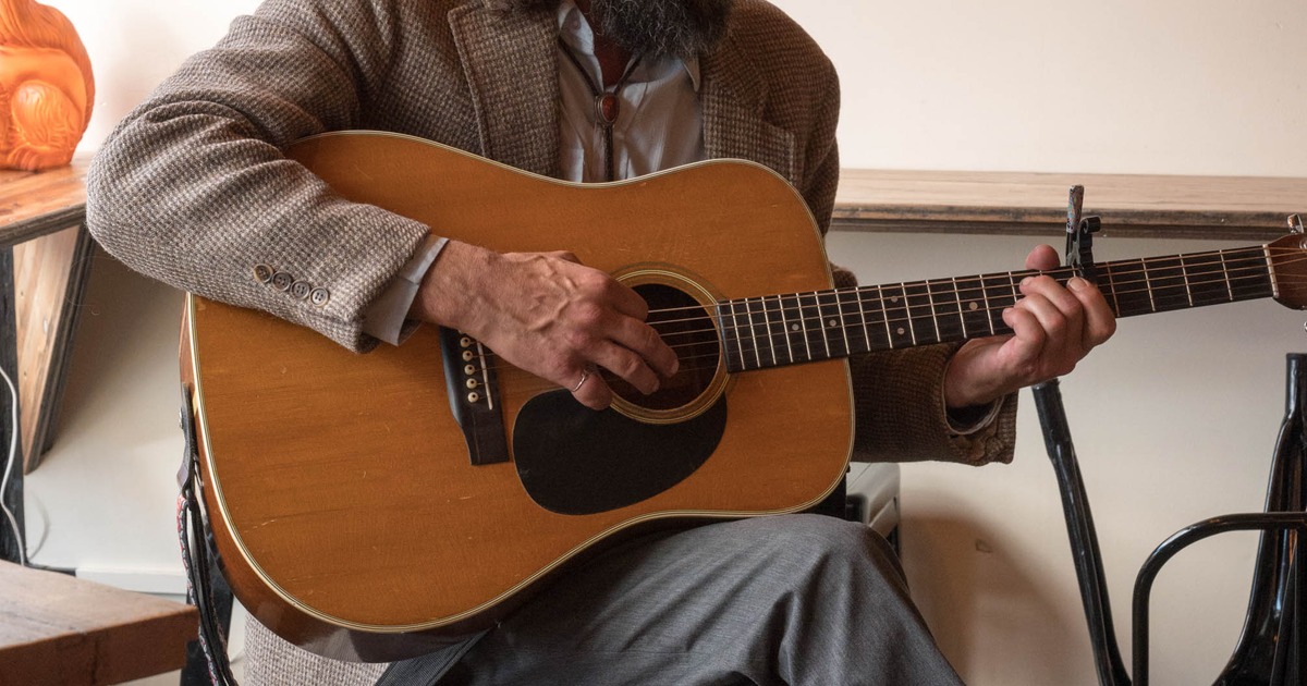 Person playing guitar