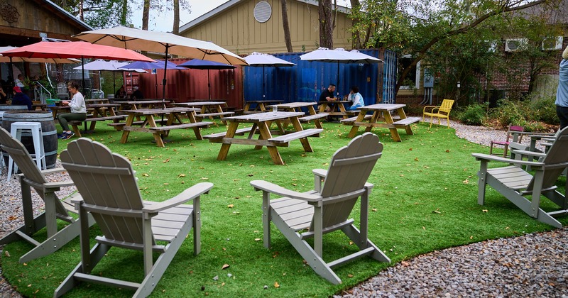 Exterior, seating and dining area, wooden tables and chairs