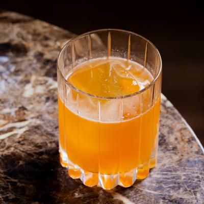 Whiskey peach cocktail, served, front view