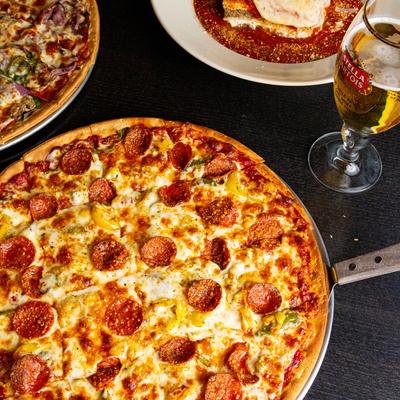 Pizza, glass of beer on the side