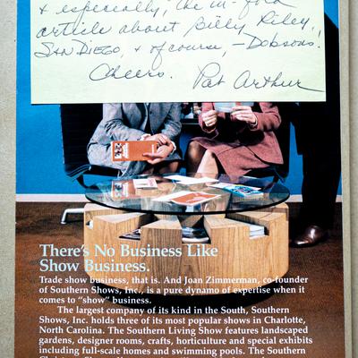 People seated at the table with brochures