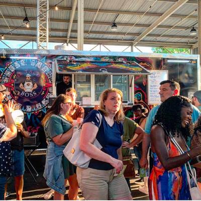 Customers gathered by the food truck.