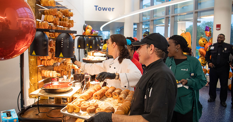 Staff members preparing buffet table