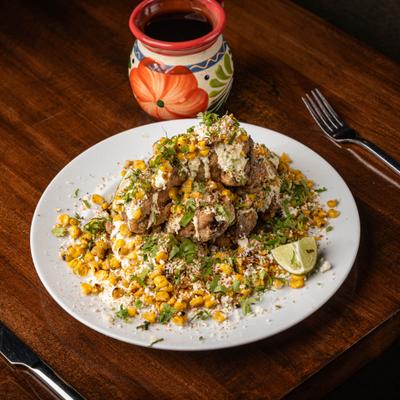 Mexican street corn with crispy pork.