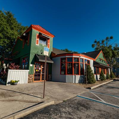 The restaurant's building and the sidewalk outside.