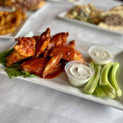 Chicken wings with dips.