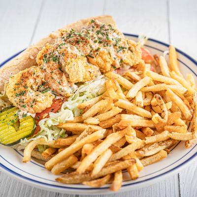 Fried seafood Po' Boy and fries.