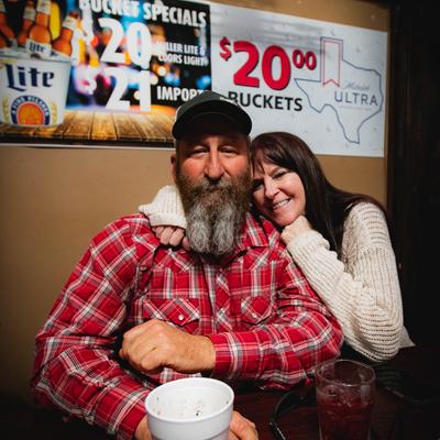 Owners posing for picture inside.