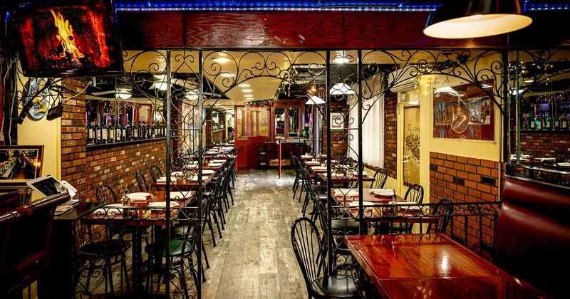 Restaurant interior, cozy dining area with set tables