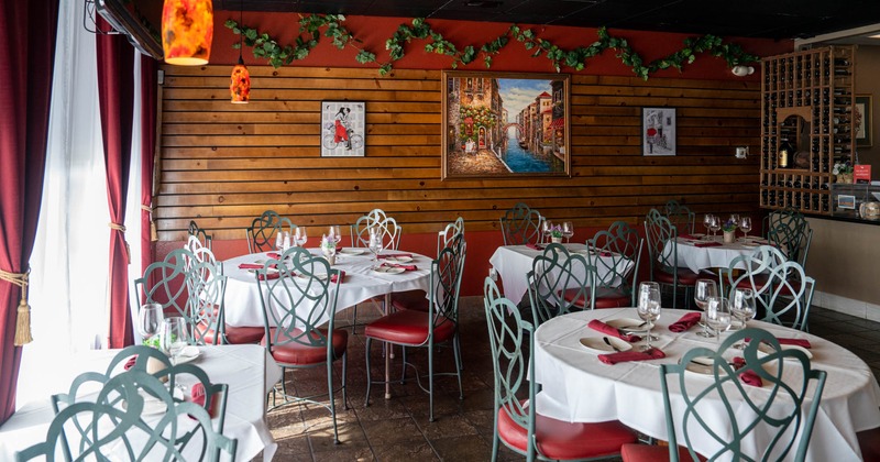 Interior, tables, chairs, wall decorations, lights, windows, curtains