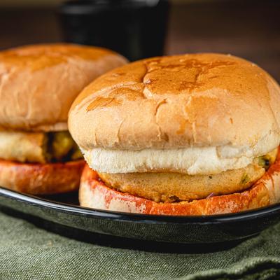 Vada Pav bread buns stuffed with deep fried potato fritter, close up.