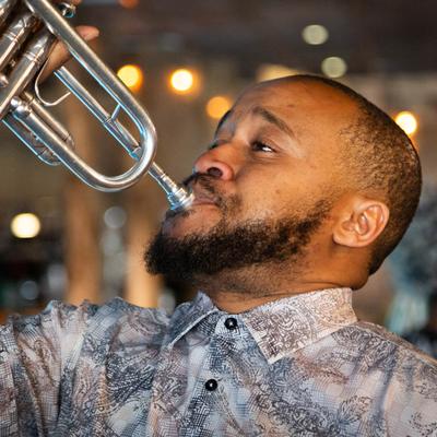 A person playing the trumpet.