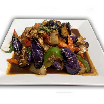 Sauteed eggplant with basil, garlic, carrot, bell pepper, and onion.