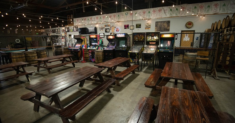 Interior seating area, conjoined wooden tables and benches