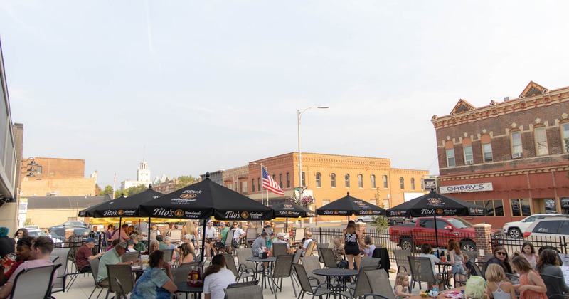 Outdoor dining area with people seated at tables