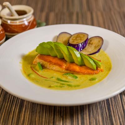 Seared salmon, with green curry paste, avocado, bell peppers, peas, carrots, and basil.