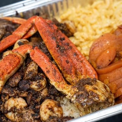 Mixed jerk meat, with sweet potatoes, and mac and cheese.