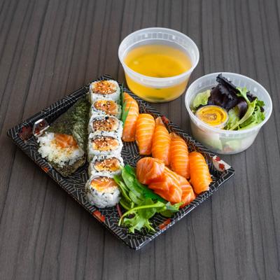 Salmon rolls, nigiri, and sashimi Bento box.