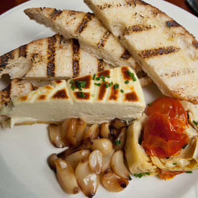 Gorgonzola Cheese Cake with Roasted garlic, artichoke salad, rustic bread