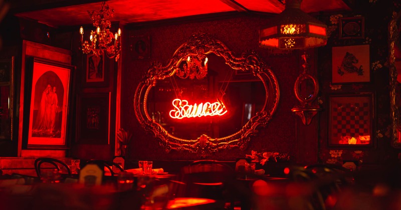 Indoor area, red neon sign on the wall