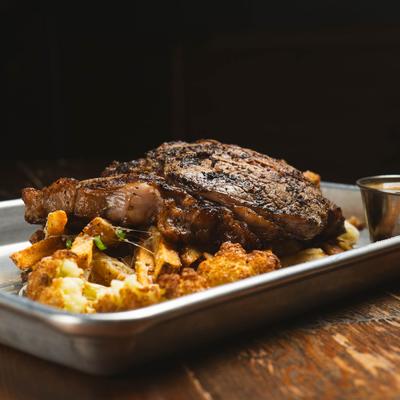 Grilled ribeye steak with fries.