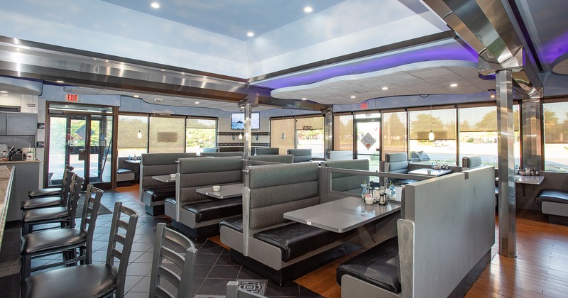 Cozy interior dining area with upholstered dining booths