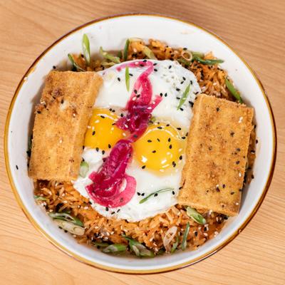 Korean breakfast rice topped with eggs.