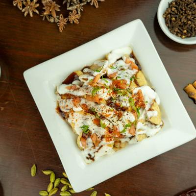 Fried flour crisps, with dumplings, chickepeas, yogurt, and chutney.